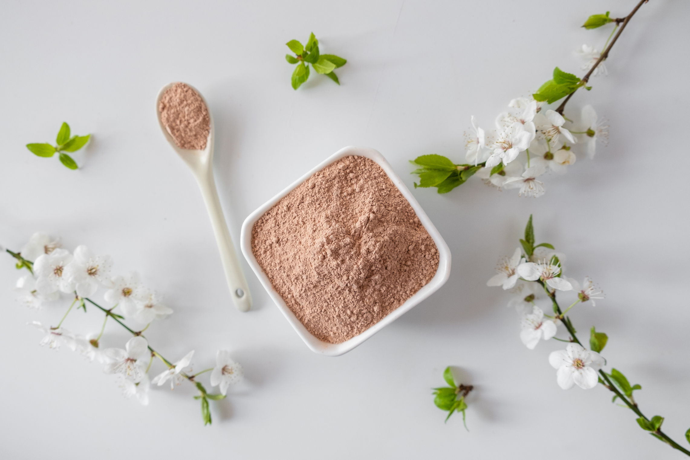 Pink Clay Mask Powder in White Bowl and Spoon 
